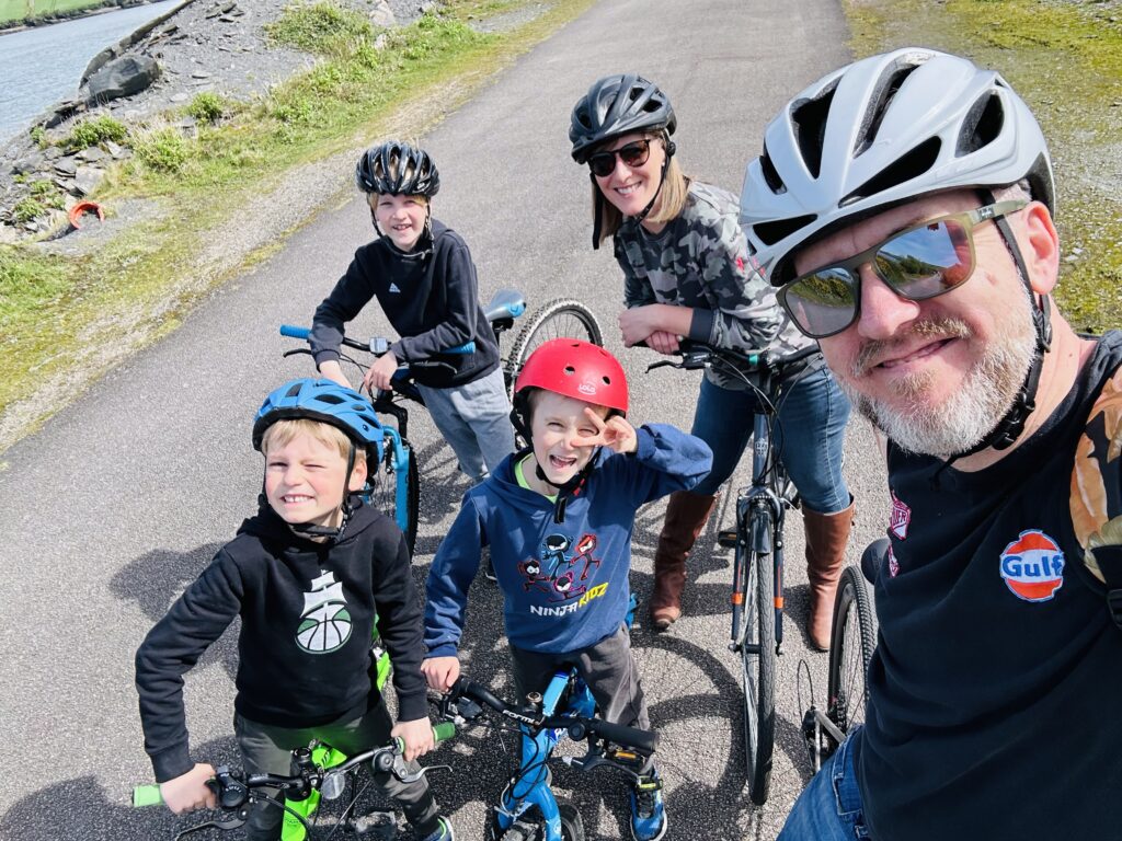 A family on their bikes on the Camel Trail in Cornwall