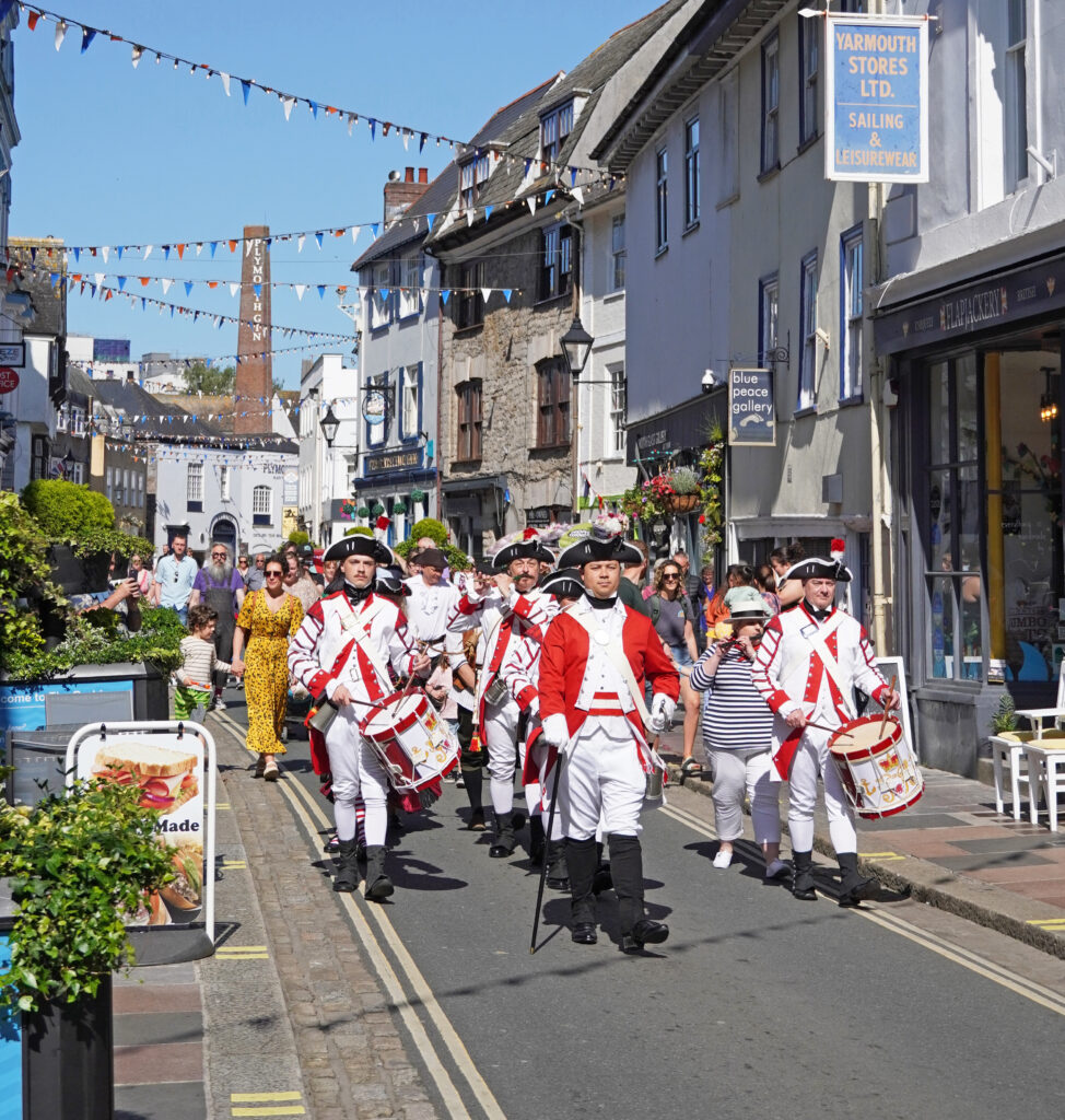 A band parade on the Barbican as part of Plymouth Pirates Weekend